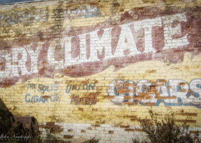 Photo of Dry Climate Cigars Sign on Building in Victor Colorado
