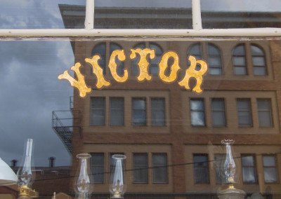 Photo of Victor Colorado Street Reflection in Store Window Color