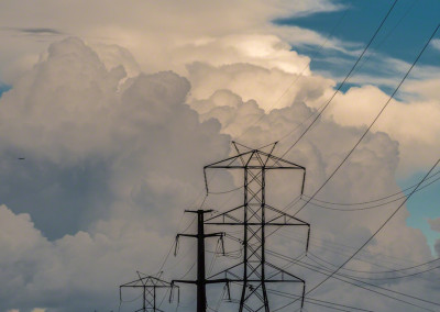 Colorado Power Line Against Clouds - Vertical