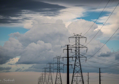 Colorado Power Line Against White Puffy Clouds