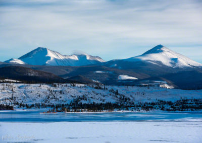 Winter Photo of Lake Dillon Partially Frozen with Swan Mountain in Background