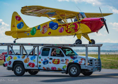 Jelly Belly Stunt Plane Taxing with Truck on Runway Waving to Crowd