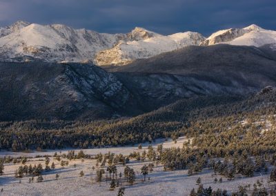 First Light on Snowy Peaks over Beaver Meadows