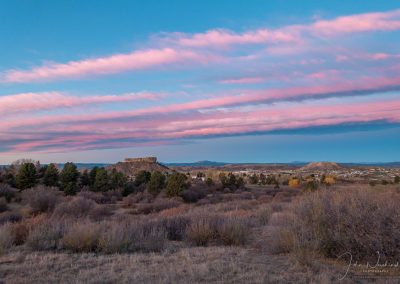 Blue Sky and Stands of Pink Clouds Sunrise Photos of the Rock in Castle Rock