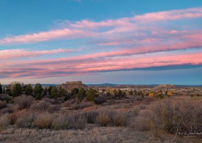 Blue Sky and Stands of Pink Clouds Sunrise Photos of the Rock in Castle Rock CO