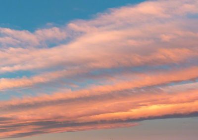 Vertical Photo of Blue Sky and Pink Orange Clouds in Castle Rock CO Sunrise