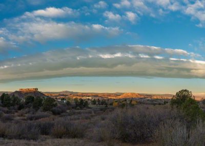 Panoramic Photo of Beautiful Blue Skies and Warm Colored Clouds First Light on the Rock in Castle Rock CO