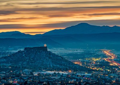 The Castle Rock Sky Glows Yellow and Gold Just After Sun Sets Behind Mountains