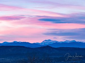 View of Snow Capped Front Range Mountains Castle Rock Colorado Sunset