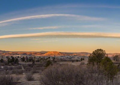 Wide Panoramic Photo of Bow Cloud Over Castle Rock at Sunrise