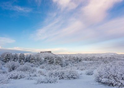 Fresh Snow Blue Sky and Wind Swept Clouds over Castle Rock