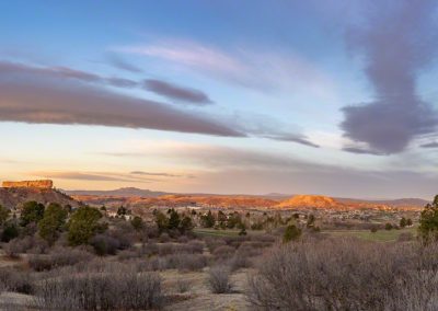Panoramic Photo of Warm Colors in Clouds over Castle Rock at Sunrise