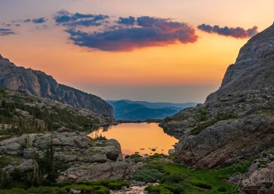 Photo of Colorful Clouds at Sunrise Reflecting Upon Lake of Glass RMNP