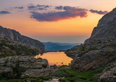 Wider View of Spectacular Sunrise Illuminating Clouds and Reflecting Upon Lake of Glass RMNP