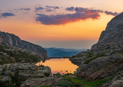 Sunrise Illuminating Clouds and Reflecting Upon Lake of Glass Below Sky Pond RMNP