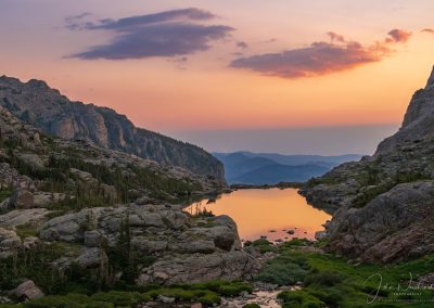 Photo of Sunrise Reflecting Upon Lake of Glass Below Sky Pond