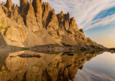 Vertical Photo of Mirror Reflection of Cathedral Spires and Sky Pond RMNP Colorado