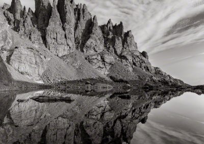 Vertical B&W Photo of Mirror Reflection of Cathedral Spires and Sky Pond RMNP Colorado