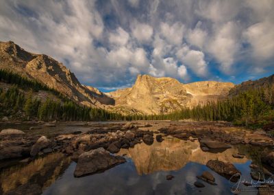Photo of White Puffy Clouds Over Notchtop Mountain and Two Rivers Lake Rocky Mountain National Park