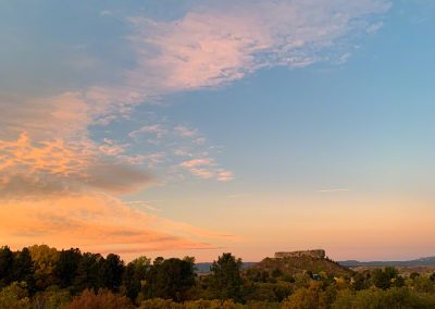 Colors of Sunrise Mimic Fall Colors in this Vertical Photo of Castle Rock CO