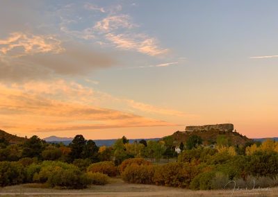 Colors of Sunrise Mimic Fall Colors in this photo of Pikes Peak and the Rock in Castle Rock CO