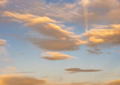 Vertical First Light of Colorful Clouds over Castle Rock Colorado