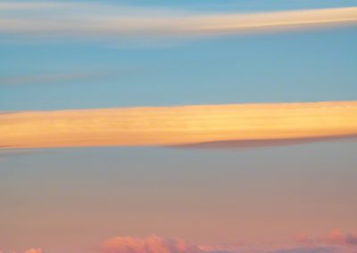 Vertical Photo of Bow Cloud over Castle Rock at Dawn