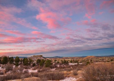 Dramatic Pink Clouds over the Castle Rock Star with fresh Autumn Snow