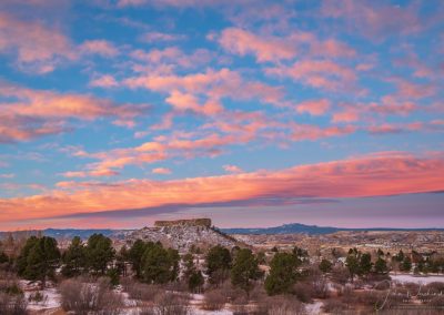 Photo of Brilliant Blue Skies and Pink Clouds over Castle Rock at Dawn