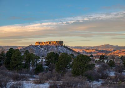 Photo of First Light on the Rock in Castle Rock after Light Evening Snow