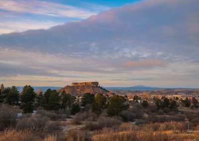 Photo of First Light on the "Rock" with Shelf Cloud Above - Castle Rock CO