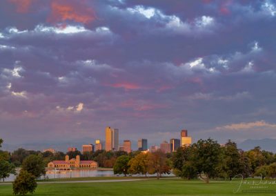 Hues of Pink and Purple Illuminate the Sky Above City Park in this Photo of Denver City Skyline