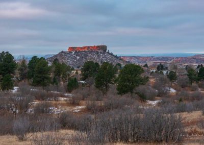 Red Light from Sunrise Illuminates the Rock in this Castle Rock CO Photo