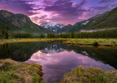 Purple Magenta Pink Sunrise over Snow Capped Mt Baldy Reflecting upon the East Inlet RMNP