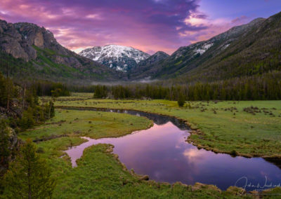 Magenta Pink and Orange Sunrise over Snow Capped Mt Baldy and East Inlet RMNP Colorado