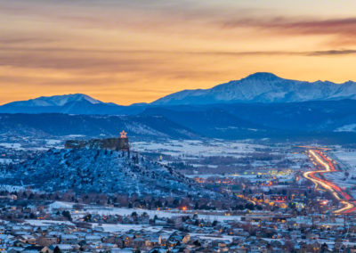 Photo of Illuminated Castle Rock Star and Pikes Peak at Sunset