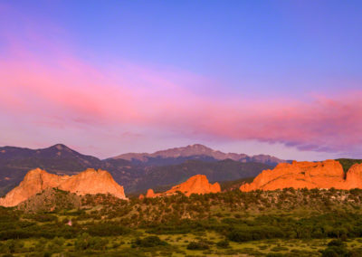 Blue Sky Panorama of Pikes Peak Garden of the Gods with Purple Pink Sunrise