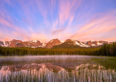 Low lying fog and Pink Yellow Clouds over Biersradt Lake RMNP Colorado at Sunrise