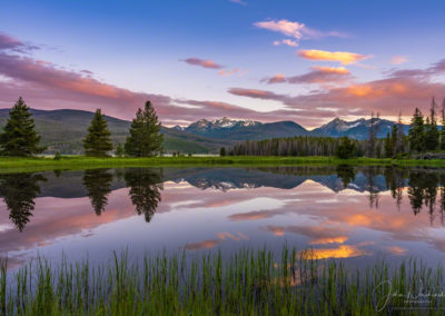 Colorful Sunrise over Baker & Bowen Mountain Reflecting on a Still Pond with Fog in Kawuneeche Valley RMNP Colorado