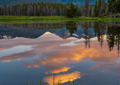 Vertical Photo of Sunrise Illuminating Baker Mountain with Reflection of Peaks on a Still Pond in Kawuneeche Valley, RMNP Colorado