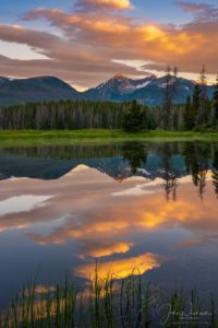 Vertical Photo of Warm Sunrise Illuminating Baker Mountain with Reflection of Peaks on a Still Pond in Kawuneeche Valley, RMNP Colorado