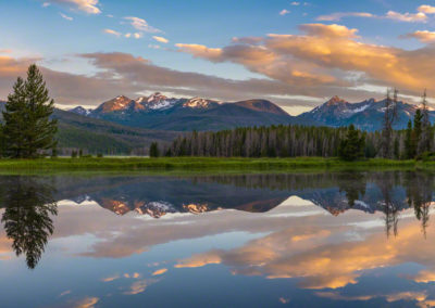 Wide Panoramic Photo of Warm Sunrise Illuminating Bowen & Baker Mountain with Reflection of Never Summer Range on a Still Pond in Kawuneeche Valley, RMNP Colorado