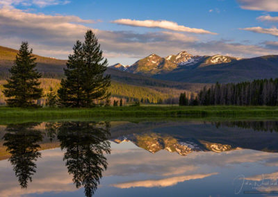 Photo of Sunrise Illuminating Bowen Mountain Peaks Reflecting upon a Still Pond in RMNP Colorado