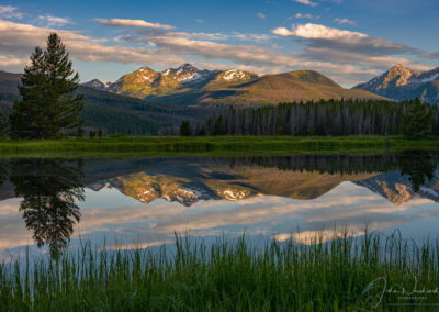 Photo of Sunrise Illuminating Bowen & Baker Mountain Peaks Reflecting upon a Still Pond in RMNP Colorado