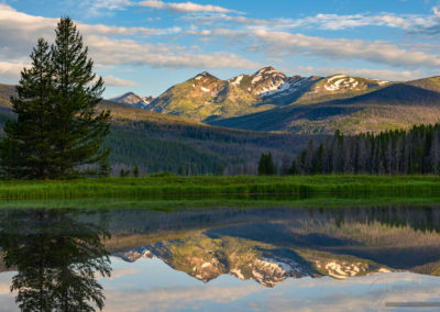 Photo of Sunrise Illuminating Bowen Mountain with Peaks Reflecting upon a Still Pond in RMNP Colorado
