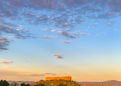 Vertical Photo of First Light on the Rock with Pastel Clouds above at Sunrise