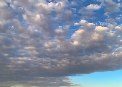 Vertical Photo of Castle Rock CO with High Shelf Clouds at Sunrise