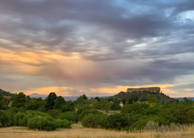 Pastel Shafts of Virga over Castle Rock with Pikes Peak in Background