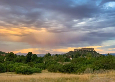 Pastel Shafts of Virga falling over Castle Rock with Pikes Peak in Background