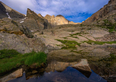 Dappled Light on Longs Peak Reflecting in Seasonal Alpine Pond Below Chasm Lake RMNP Colorado